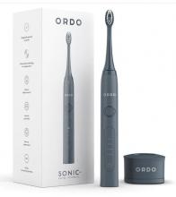grey toothbrush, with grey charging base and white box with toothbrush on behind it on a white background