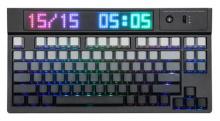black keyboard with gradient grey to black keys, keys have no symbols on the tops, top of keyboard has a LED display showing the date and time in a rainbow colour effect