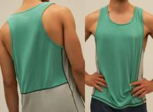 two side by side images of a man wearing a green sports vest which has grey side and back panels