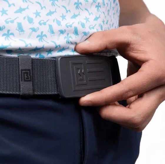 man wearing belt, holding the side 