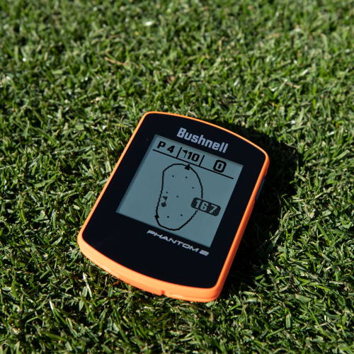 Black and orange Phantom 2 laying on the grass, displaying a course map