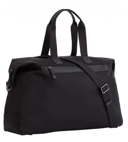 The Weekender bag in profile. A sizable black bag with a zip along the side, a shoulder strap and two handles