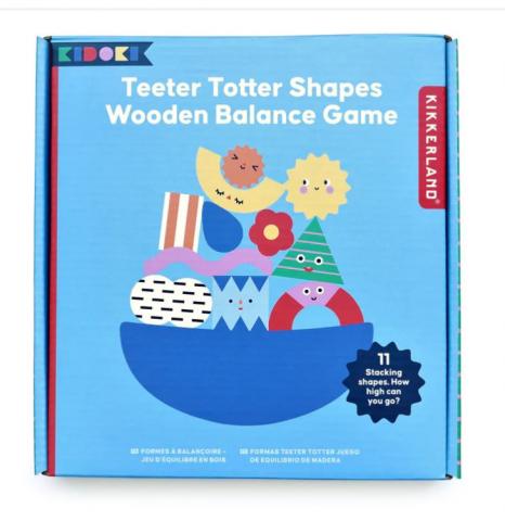 blue cardboard box labelled teeter totter shapes wooden balance game, with front image of a blue bowl with various shapes balanced on top