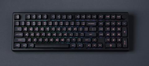 black computer keyboard on a dark grey background 