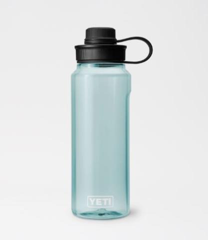 light blue-green clear water bottle, with a black cap on a white background 