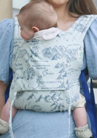 baby in light blue baby carrier sling 