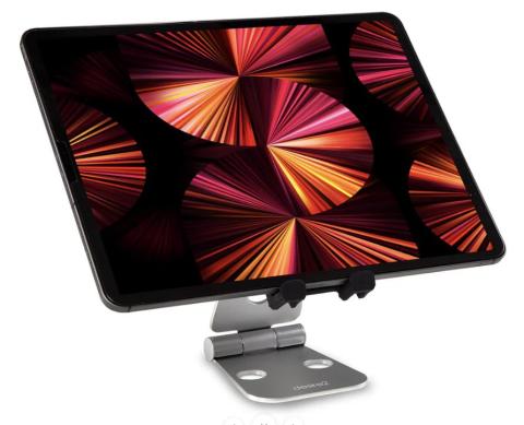 tablet with pink fan design on the screen, sat on a silver tablet stand, all on a white background 