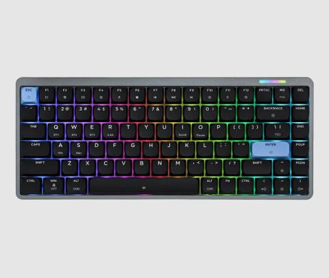 black keyboard on a white background, with blue ESC and ENTER keys, under each key are lights which deliver a rainbow effect glow across the keyboard