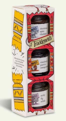 white box with a red Christmas cracker design on the front, with cut outs showing three different condiment jars inside 