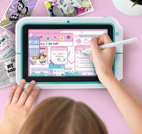 child writing with a white pen on a blue digital tablet 