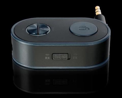 small oblong shaped adapter with buttons on the top and a headphone jack sticking out from the back