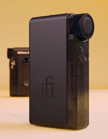 compact rectangular amp/DAC device, with a textured panel with a 'iFi' logo on the front, and a large circular knob at the top