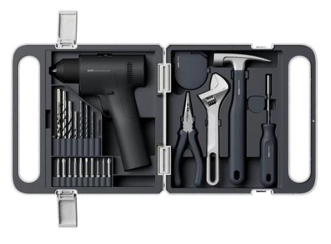 Image of open toolkit, containing cordless drill and multiple drill bits on one side, and pliers, a wrench, hammer and screwdriver on the other side. 