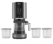 The Ninja CREAMi Ice Cream Maker in black, placed next to 3 small see-through pots 