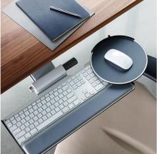 The Humanscale Proclick Ergonomic Mouse on a desktop. 