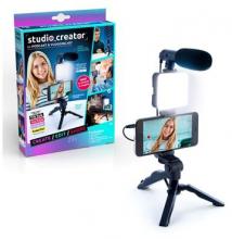 Purple and blue box with a girl holding a vlogging camera set up, with the vlogging camera set up in front of the box