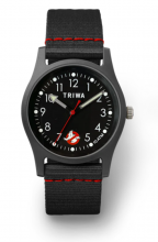 watch with black watch strap with red detailing and black watch face with glow in the dark aspects