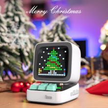 computer style mini speaker with a pixel tree on the screen and a festive background 