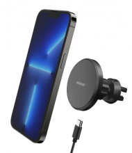 iPhone above a black circular wireless car mount attachment and charging wire 