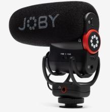 black microphone with 'JOBY' written on the side, the microphone sits on a black mount and has a red and white dial at the back 