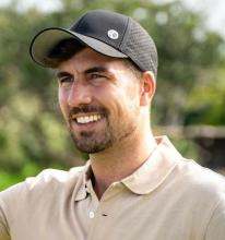 man wearing black base ball cap