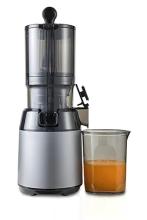 black and grey juicer, with juicer jug next to it filled with orange liquid 