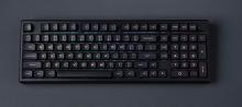 black computer keyboard on a dark grey background 