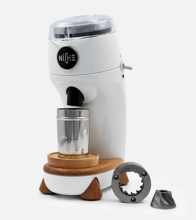 white coffee grinder unit, with clear cup at the front 