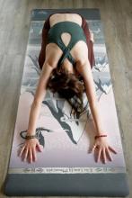 person doing a yoga move on a mountain design yoga mat