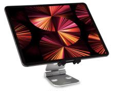tablet with pink fan design on the screen, sat on a silver tablet stand, all on a white background 