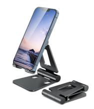 phone on phone stand with a folded down stand next to it, on a white background 