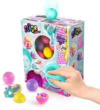 colourful box filled with different coloured balls inside, with a hand turning a teal green handle on the front 