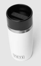 white travel bottle with black lid and stainless steel lid trim, front of bottle says 'YETI' in silver