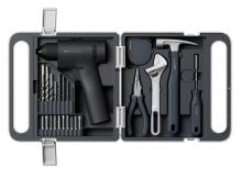 Image of open toolkit, containing cordless drill and multiple drill bits on one side, and pliers, a wrench, hammer and screwdriver on the other side. 