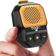 Image of small Bluetooth speaker in black with a yellow grill on the front, held between a thumb and forefinger. 